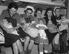 Five of the seven "Schwangerenkommando" women, and their infants, after liberation