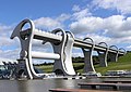 Image 15The Falkirk Wheel, named after the nearby town of Falkirk, is a rotating boat lift connecting the Forth and Clyde Canal with the Union Canal. The wheel raises boats by 24 metres. Photo credit: Sean Mack