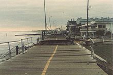 A boardwalk in Ocean City, New Jersey, is shown to have been buckled and eroded by Hurricane Gloria.