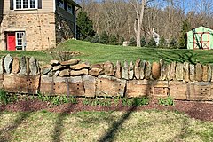 Sleeper stones from Inclined Plane 7 West used as the base of retaining wall