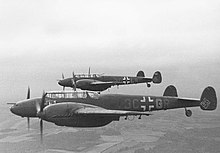 a black and white photograph of an aircraft in flight