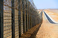 Image 1A more recent section of the Israel-Egypt barrier fence, north of Eilat, June 2012. It is a border barrier built by Israel along its border with Egypt. It was originally an attempt to curb illegal migrants from African countries.[1] Construction was approved on 12 January 2010[2] and began on 22 November 2010.[3]