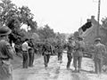 Major David V. Currie (with pistol), accepting the surrender of German troops at St. Lambert-sur-Dives, France, 19 August 1944. This photo captures the actions that led to him being awarded the Victoria Cross