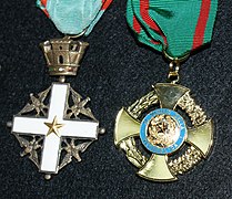 Comparison of the pre-2001 (at left) and the post-2001 (at right) badges of the Order