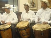 Puerto Ricans playing the Barril drum traditionally used in Bomba music