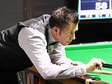 Dominic Dale playing a shot with a rest