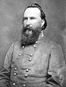Portrait photograph of Longstreet with a large beard in his gray Confederate uniform