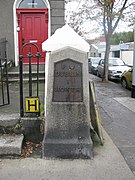 A milestone in North Strand Dublin, marking one mile along the roads to Howth and Malahide