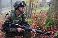 Image 4A soldier from Moldova pulls security while conducting a company situational training exercise during exercise Combined Resolve III at the Joint Multinational Readiness Center in Hohenfels, Germany, Oct. 26, 2014