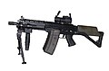 The SG 552 Commando version with integral Picatinny rail and accessories.