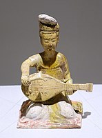 One of a group of seated female musicians