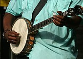 United States. Banjo in the hands of Taj Mahal.