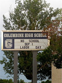 School sign of Columbine High School. Text reading "No school Sep 1, Labor Day".