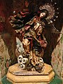 Virgin of Quito” by Bernardo de Legarda. The wooden sculpture follows the theme of the Woman of the Apocalypse.