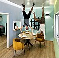 Building rooms where the furniture is attached to the ceiling makes it appear the two men are upside down.