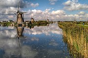 Kinderdijk windmills mirrored at the channel