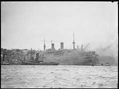 Ship surrounded by tug boats, Sydney, 1942