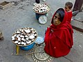 Woman selling candles