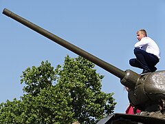 Young man on a Soviet-era tank in Tiraspol