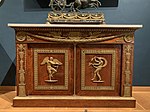 Commode with two door panels; before 1805; mahogany with bronze mounts; 1.165 x 1.794 x 0.83 m; Louvre[12]