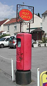 Unusual bracket carrying a Post Office "Lozenge" fitted to a Type K pillar at Easter Compton, S. Gloucs