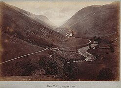 Wilson's August 1885 photograph of the Glen Tilt looking upstream toward Forest Lodge. Location: 56°49′29″N 3°47′38″W﻿ / ﻿56.82461°N 3.79392°W﻿ / 56.82461; -3.79392﻿ (Glen Tilt June 2019)