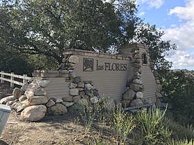 Entrance sign for Las Flores along Oso Parkway