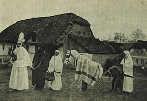 A St. Nicholas procession with Krampus, and other characters, c. 1910
