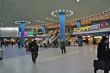 Penn Station concourse with escalators and stairs in the background