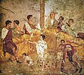 Image 47A multigenerational banquet depicted on a wall painting from Pompeii (1st century AD) (from Roman Empire)