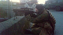 A sniper from the Norwegian Home Guard's task force "Bjørn West" armed with an HK417 designated marksman rifle.