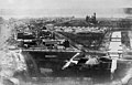 Image 471863 photograph of the National Mall and vicinity during the Civil War, looking west towards the U.S. Botanical Garden, Washington City Canal, Gas Works, railroad tracks, Washington Armory, and Armory Square Hospital buildings. The Smithsonian Institution Building, the uncompleted Washington Monument (behind the Smithsonian's building), and the Potomac River are in the background. (from National Mall)