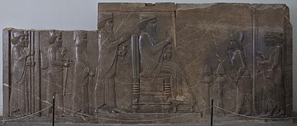 The central wall of the northern stairs of Apadana palace, which shows Xerxes sitting on the throne and receiving an important official. Kept at the National Museum of Iran. Its counterpart remains at Persepolis.