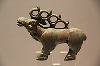 An elk from Longqu (龙渠乡), Zhangye, 475–221 BCE.[15] Shajing culture.[16]