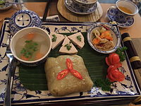 Bánh chưng is served with chả lụa and other dishes