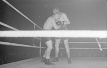 Black and white photo of two competitors in a boxing ring