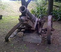 The remains of a German sFH 02 howitzer located in Kei Mouth, South Africa. It was captured from German forces in South West Africa during World War I. Like other such German weapons of the time, it was cast with the markings R II Ultima Ratio Regum ("last argument of kings").