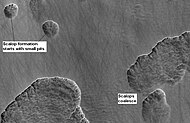 Stages in scalop formation, as seen by HiRISE. These formations probably form from the sublimation of ground rich in pure water ice many meters in depth.[102]