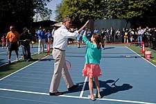 Barack Obama and his partner during tennis games on the court at the 2012 Easter Egg Roll at the White House