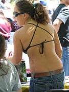Woman wearing bikini top and jeans in USA, 2010.