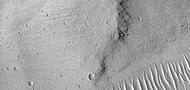 Grooves on wall of Kasei Valles, as seen by HiRISE under HiWish program. Grooves may be caused by water moving in the channel.