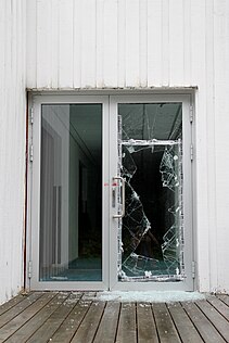 A broken glass door.