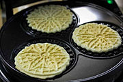 Thin wafer cookies such as pizzelle have been made since the Middle Ages.[23]