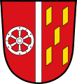 Gemeinde Röllbach In Rot ein schmaler silberner Pfahl; vorne ein sechsspeichiges silbernes Rad, hinten fünf, zwei zu eins zu zwei gestellte, goldene Schindeln.