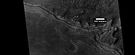 Wide view of mesa breaking up into rocks, as seen by HiRISE under HiWish program. Parts of this image are shown enlarged in the next two images.