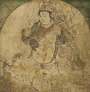 A feitian playing pipa, wall painting from Kizil, pigment on stucco, Tang dynasty, 600–800.
