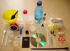 Various plastic objects, including a bowl, CD, water bottle, and roll of tape
