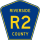 County Road R2 marker