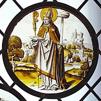 Renaissance roundel using only black or brown glass paint, and silver stain. The bishop-saint Lambrecht of Maastricht stands in an extensive landscape, 1510–20. Diameter 8+3⁄4 in (22 cm). Designed to be placed low, close to the viewer.