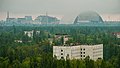 Image 60The town of Pripyat abandoned since 1986, with the Chernobyl plant and the Chernobyl New Safe Confinement arch in the distance (from Nuclear power)